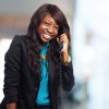 woman-laughing-while-talking-phone_1187-1150